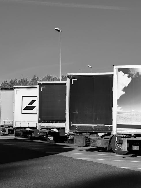 A close-up view of a white metal sign attached to a dark grey or black vented building exterior. The sign displays the text 'PRIVATE PROPERTY LOADING ZONE ONLY' in bold, black capital letters. The background shows horizontal slats or louvers, likely part of a loading dock or building facade, with some areas slightly out of focus to emphasize the sign. The setting suggests a designated area for moving vehicles and furniture transport, relevant to home relocation and packing and moving services, with natural lighting highlighting the sign's details. This visual context aligns with logistical aspects of professional removals, such as loading and unloading furniture and boxes, as handled by Lambeth Removals, supporting services related to removals and vehicle access permissions, consistent with the information on the Lambeth council parking permits page.